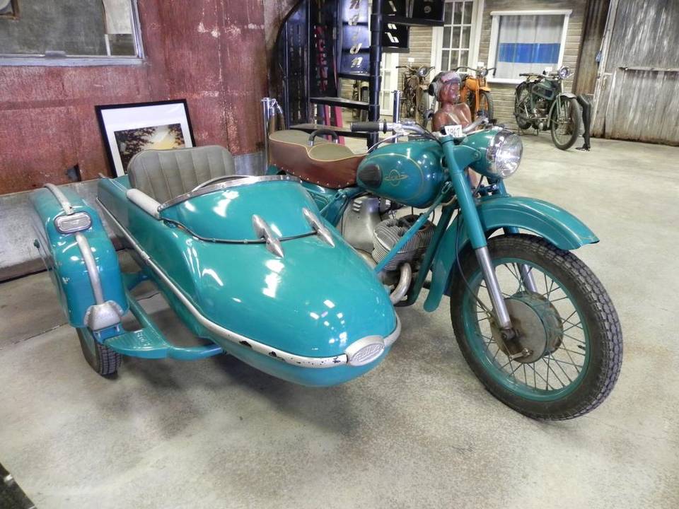 Turquoise Russian Izh motorcycle with sidecar